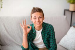 boy giving the ok sign